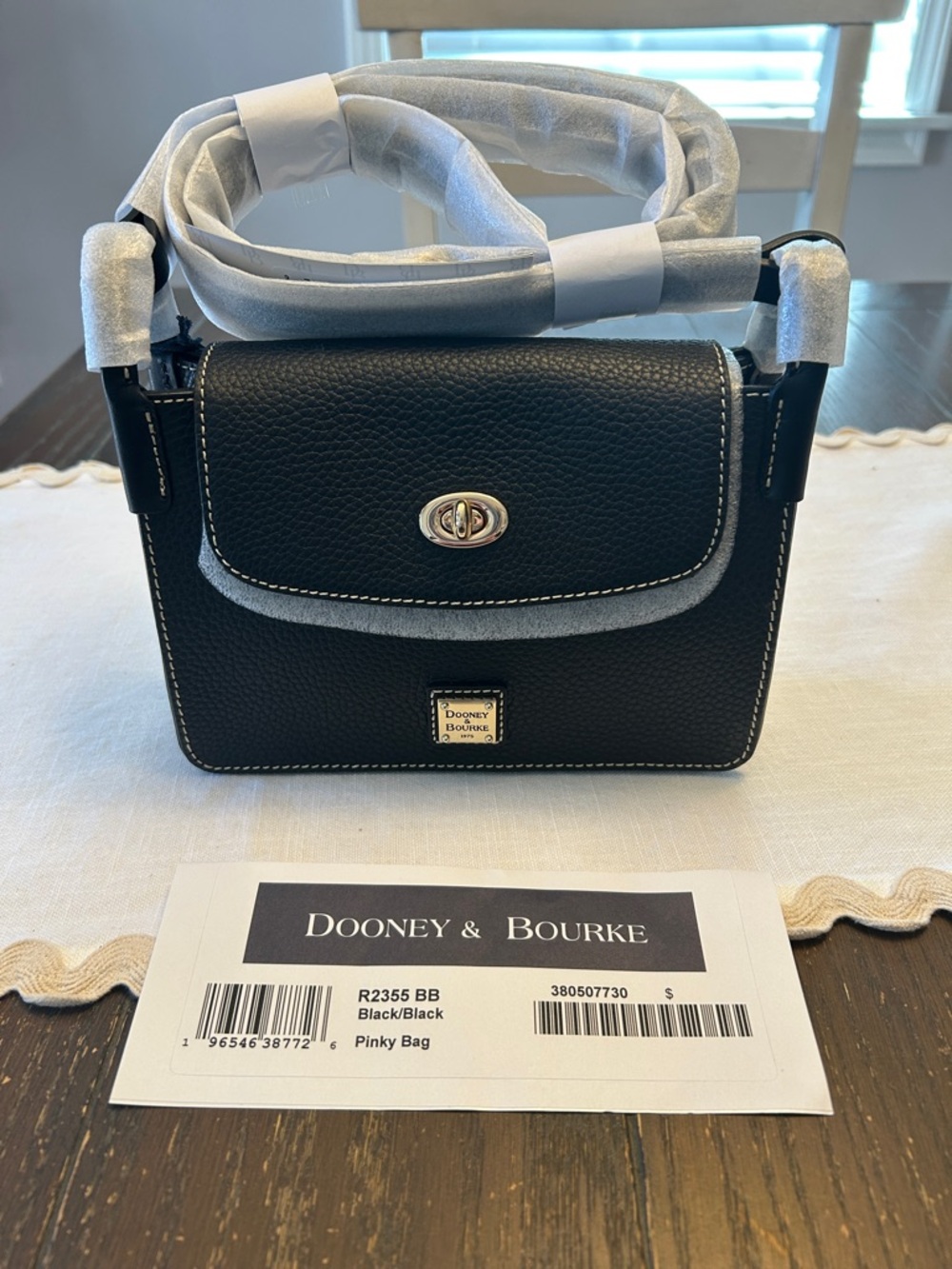 Dooney & Bourke Black Pebbled Leather Grain Pinky Bag